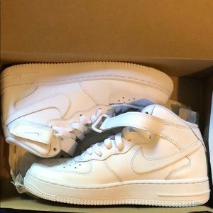 All white mid top Air Force Ones